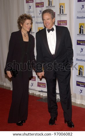 Actor WARREN BEATTY & wife actress ANNETTE BENING at the 8th Annual Hollywood Film Festival\'s Hollywood Awards at the Beverly Hills Hilton. She won the award for Actress of the Year. October 18, 2004