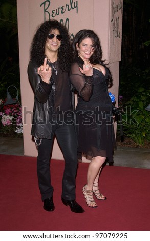 Feb 12, 2005; Beverly Hills, CA: Guns n' Roses star SLASH & wife at record mogul Clive Davis' Annual pre-Grammy party at the Beverly Hills Hotel.