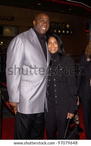 Feb 14, 2005; Los Angeles, CA: Former basketball star EARVIN MAGIC JOHNSON & wife Cookie at the world premiere of Be Cool, at the Grauman\'s Chinese Theatre, Hollywood.