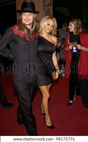 Rock star KID ROCK & girlfriend actress PAMELA ANDERSON at pre-Grammy party given by Clive Davis of J Records at the Beverly Hills Hotel. 25FEB2002   Paul Smith / Featureflash