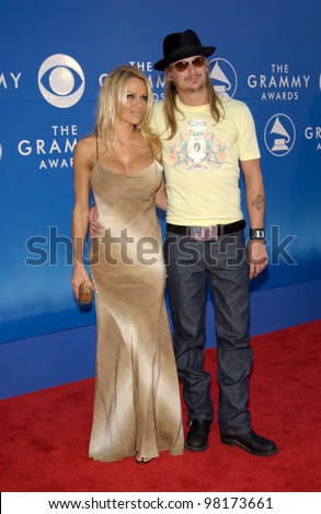 Actress PAMELA ANDERSON & rock star boyfriend KID ROCK at the 2002 Grammy Awards in Los Angeles.
