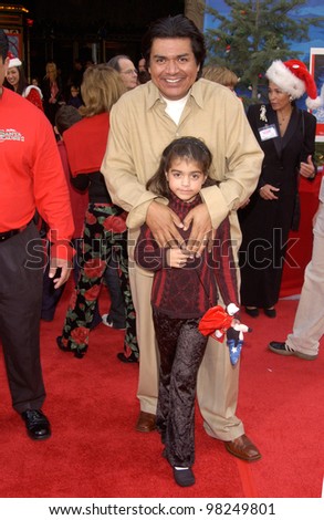Actor GEORGE LOPEZ & daughter MAYA at the world premiere of The Santa Clause 2, at the El Capitan Theatre, Hollywood. 27OCT2002.   Paul Smith / Featureflash
