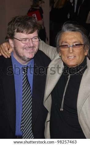 Director MICHAEL MOORE (left) & producer ROBERT EVANS & date at the Broadcast Film Critics 8th Annual Critics\' Choice Awards at the Beverly Hills Hotel. 17JAN2003.   Paul Smith / Featureflash