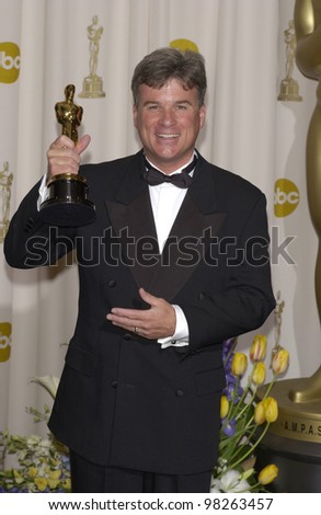 CONRAD W. HALL, with the award for his late father Conrad L. Hall who won for Best Cinematography at the 75th Annual Academy Awards at the Kodak Theatre, Hollywood. March 23, 2003