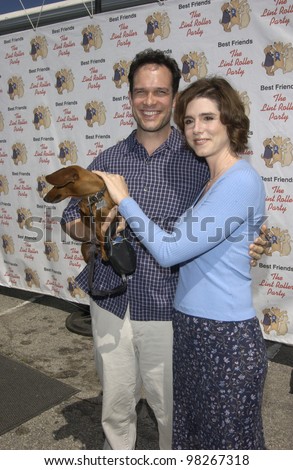 Actor DIEDRICH BADER & wife & dog at the Best Friends Lint Roller Party at Santa Monica Airport, California. The event was held to benefit the Best Friends Animal Sanctuary. march 2003