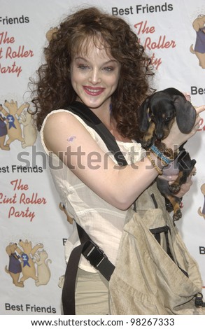 Actress DANA DAUREY & dog at the Best Friends Lint Roller Party at Santa Monica Airport, California. The event was held to benefit the Best Friends Animal Sanctuary. march 2003
