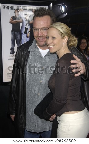 Actor TOM ARNOLD & wife at the Los Angeles premiere of  Malibu\'s Most Wanted. April 10, 2003