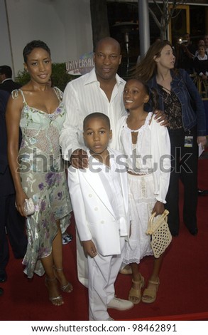 Director JOHN SINGLETON & family at the world premiere of 2 Fast 2 Furious at the Universal Amphitheatre, Hollywood. June 3, 2003