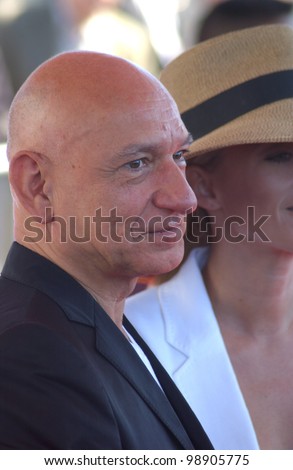 SIR BEN KINGSLEY & wife at the 2004 IFP Independent Spirit Awards on the beach at Santa Monica, CA. February 28, 2004