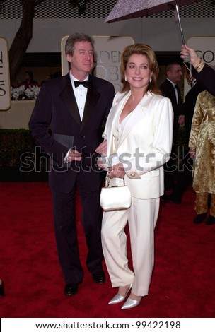23JAN2000:  Actress CATHERINE DENEUVE & escort at the Golden Globe Awards in Beverly Hills.  Paul Smith / Featureflash