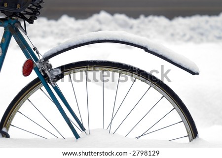 Detail of a Rear Bicycle Wheel Buried in a Snow Bank