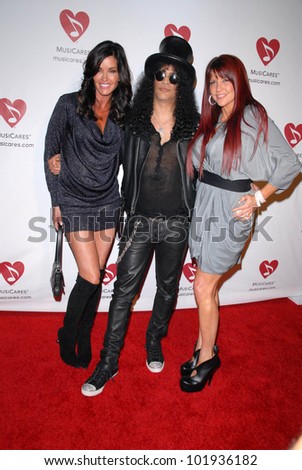 Janice Dickinson, Slash and wife Perla Ferrar  at the 6th Annual Musicares MAP Fund Bevefit Concert celebrating women in  recovery, Club Nokia, Los Angeles, CA. 05-07-10