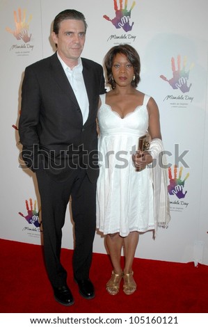 Roderick Spencer and Alfre Woodard at the Launch of \'Mandela Day\'. Beverly Hills Hotel, Beverly Hills, CA. 05-14-09