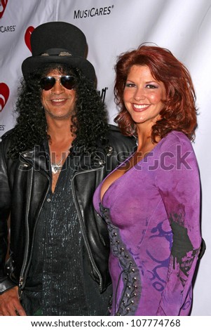 Slash and wife Perla  at the 4th Annual MusiCares MAP Fund Benefit Concert. The Music Box, Hollywood, CA. 05-09-08