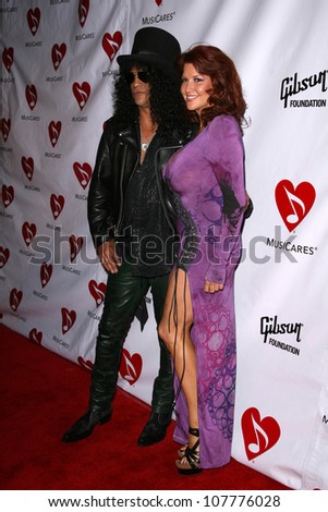 Slash and wife Perla  at the 4th Annual MusiCares MAP Fund Benefit Concert. The Music Box, Hollywood, CA. 05-09-08