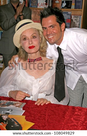 Julie Newmar and RAD  at an in store appearance signing copies of the poster print series 