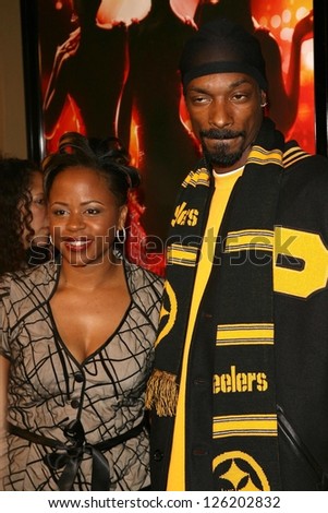 Snoop Dogg with guest at the premiere of \