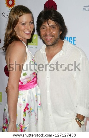 SANTA MONICA - JULY 23: Rita Branch and Roger Zamudio at the Sexy Summer Soire Party hosted by H.U.G.E benefiting Heal The Bay at AKWA Restaurant and Club on July 23, 2006 in Santa Monica, CA.