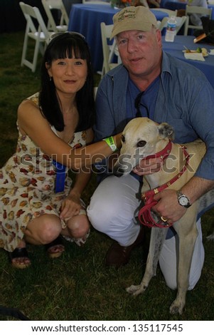 WOODLAND HILLS - APRIL 30: Suzanne Whang and guest at the Nuts For Mutts Dog Show at Pierce College on April 30, 2006 in Woodland Hills, CA.