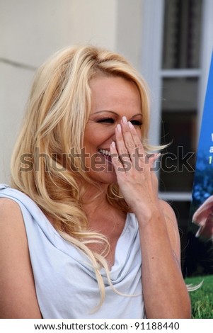 Pamela Anderson at the PETA Goes Postal Postage Stamp Unveiling, Hollywood Post Office, Hollywood, CA 11-29-11
