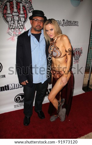 Kyle T. Heffner and Paula Labaredas at the Vera Mesmer Video Release Party, featuring Harry The Dog and Paula Labareas of ComicCosplay, Aqua Lounge, Beverly Hills, CA. 03-09-11