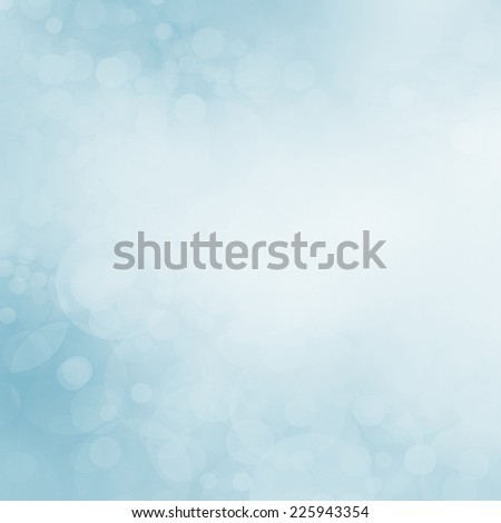 blue bokeh background, faded white blurred color and circles shapes in random pattern, soft pretty blue sky with falling snow