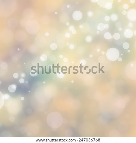 blurred bokeh background in off white beige and pastel blue colors, magical bubbles or circles floating in the sunshine with blurry abstract out of focus background