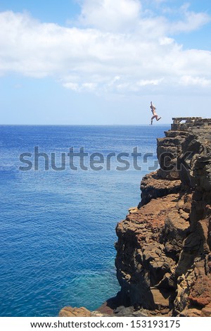 Woman Cliff Jumping in Hawaii