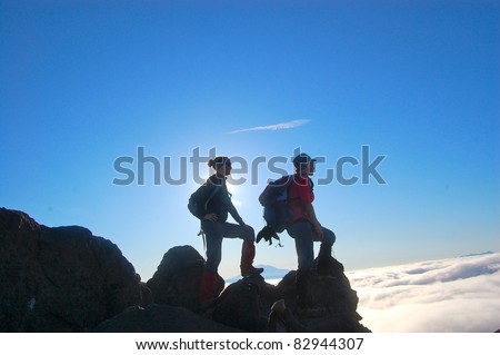 Two Silhouette Hikers Climbing Mountain Mt St. Helens