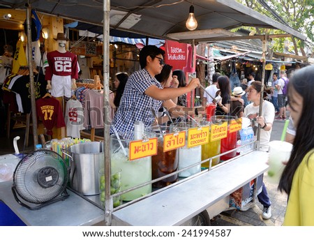 BANGKOK, THAILAND - JANUARY 4, 2015. Unidentified seller is selling ice juice at Jatujak Market. Jaujak Market is the biggest weekend market in South East Asia.