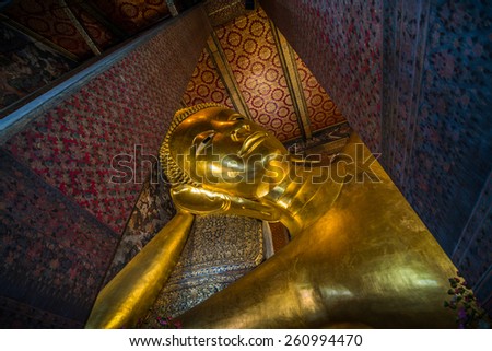 Bangkok, Thailand - Mar 13 , 2015: The Reclining Buddha of Wat Pho is a Buddha image of early Bangkok Period, in brick and stucco, lacquered and gilded.