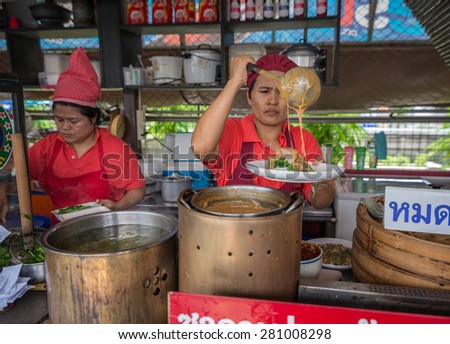 Bangkok, Thailand - May 23, 2015 Unidentified woman is selling selling Thai tradition food called Pra Ram Lon Sorn at Or Tor Kor markrt, a well known place next to Jatujak market.