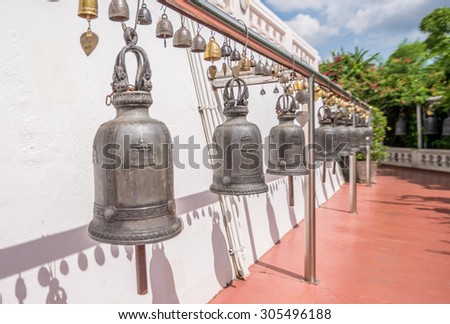 Bangkok, Thailand - Aug 10, 2015 Old bells for people to ring to make a wish and respect the temple of The Golden Mount.