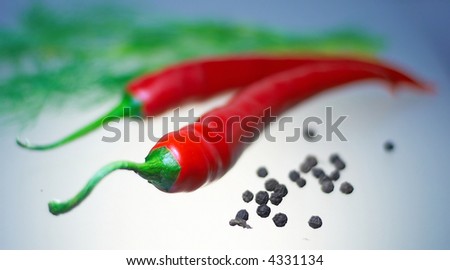 Chilly pepper with black seeds and dill (shallow DOF)
