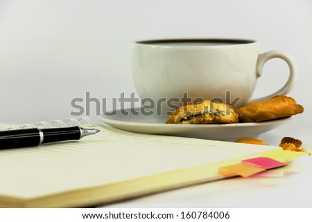 cup of coffee,cookies,notebook and pen isolated on white background.