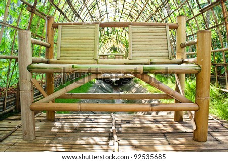 Chair made from bamboo in garden architecture of bamboo for planting vegetables.