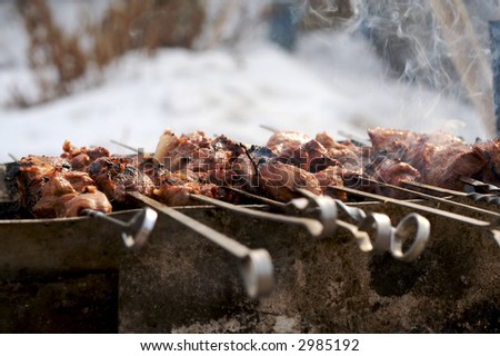 meat cooking on fire