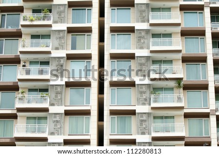 house facade with many balconies in row