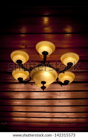 Vintage ceiling lamp fixture in dark hallway
