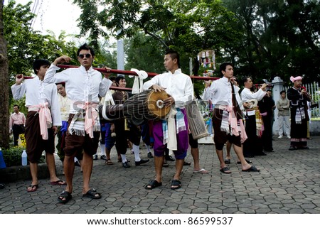 BANGKOK, THAILAND - OCTOBER 2: An unidentified man plays in a Thai music show during a traditional merit parade of people from the northern territory of Thailand, October 2, 2011 in Bangkok, Thailand