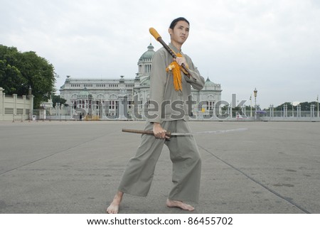 BANGKOK, THAILAND - OCTOBER 2: An unidentified man performs a Thai traditional dance during a parade of people from the northern territory of Thailand, October 2, 2011 in Bangkok, Thailand.