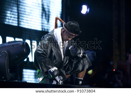 BANGKOK, THAILAND- DEC 18 : Unidentified boxer competes in Thai Fight Final:Muay Thailand World\'s Unrivalled Fight on Dec. 18, 2011 at King Chulalongkorn Monument Square in Bangkok, Thailand