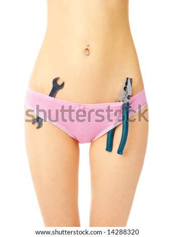 stock photo Sexy young girl in pink panties with screw key and pliers over