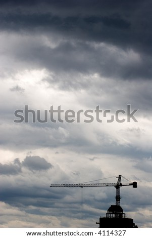 construction crane on a stormy sky