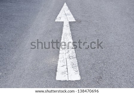 This is the one sign that mean go straight we can see on the road and floor.