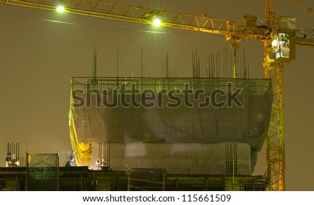 construction at night with Worker and crane