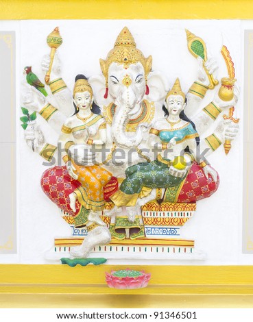 Indian God Ganesha or Hindu God Name Duraga Ganapati avatar image in stucco low relief technique with vivid color,Wat Samarn temple,Thailand.