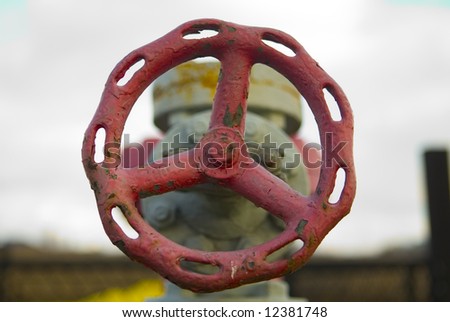 Outdoor steel, old, water valve painted red and gray