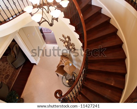 Interior view of a foyer with curving staircase