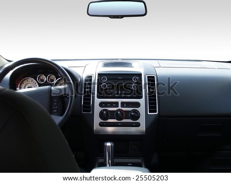 View of the interior of a modern automobile showing the dashboard and rear view mirror. A clipping path of the windshield and mirror are included so you can replace it with whatever you like!